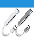 4-port USB 3.0 hub in aluminium, shown in silver and white with attached cable