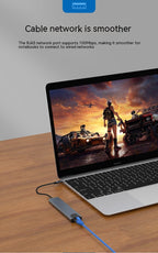 8-in-1 USB-C Hub with 4K HDMI used on a desk setup, alternate view