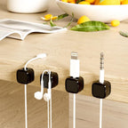 Magnetic Cable Management Clips used on a desk setup, alternate view